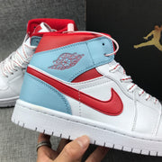 Close-up of the winged basketball emblem, ice blue collar panel, and red Swoosh.