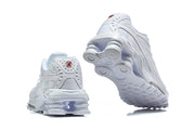 Rear and outsole views of white Nike Shox Ride 2 sneakers.