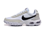 Side view of a white and grey Nike Air Max Waffle SP sneaker with a black Swoosh and sculpted midsole.