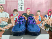Front view of a pair of dark blue Nike GT basketball sneakers with purple laces and contrasting toe details.