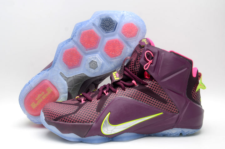 Pair of burgundy and pink Nike high-top basketball sneakers shown from the side and outsole.