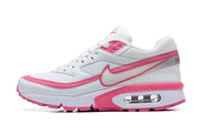 Side profile of a white and pink Nike Air Max BW-style sneaker.