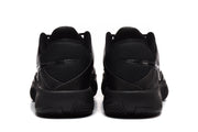 Rear view of the black sneakers showing padded heel areas, tonal branding and textured outsole edges.