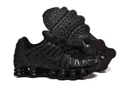 Black Nike Shox TL sneaker with outsole visible beside it.