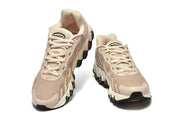Front views of beige Nike Air Max DN8 lace-up sneakers