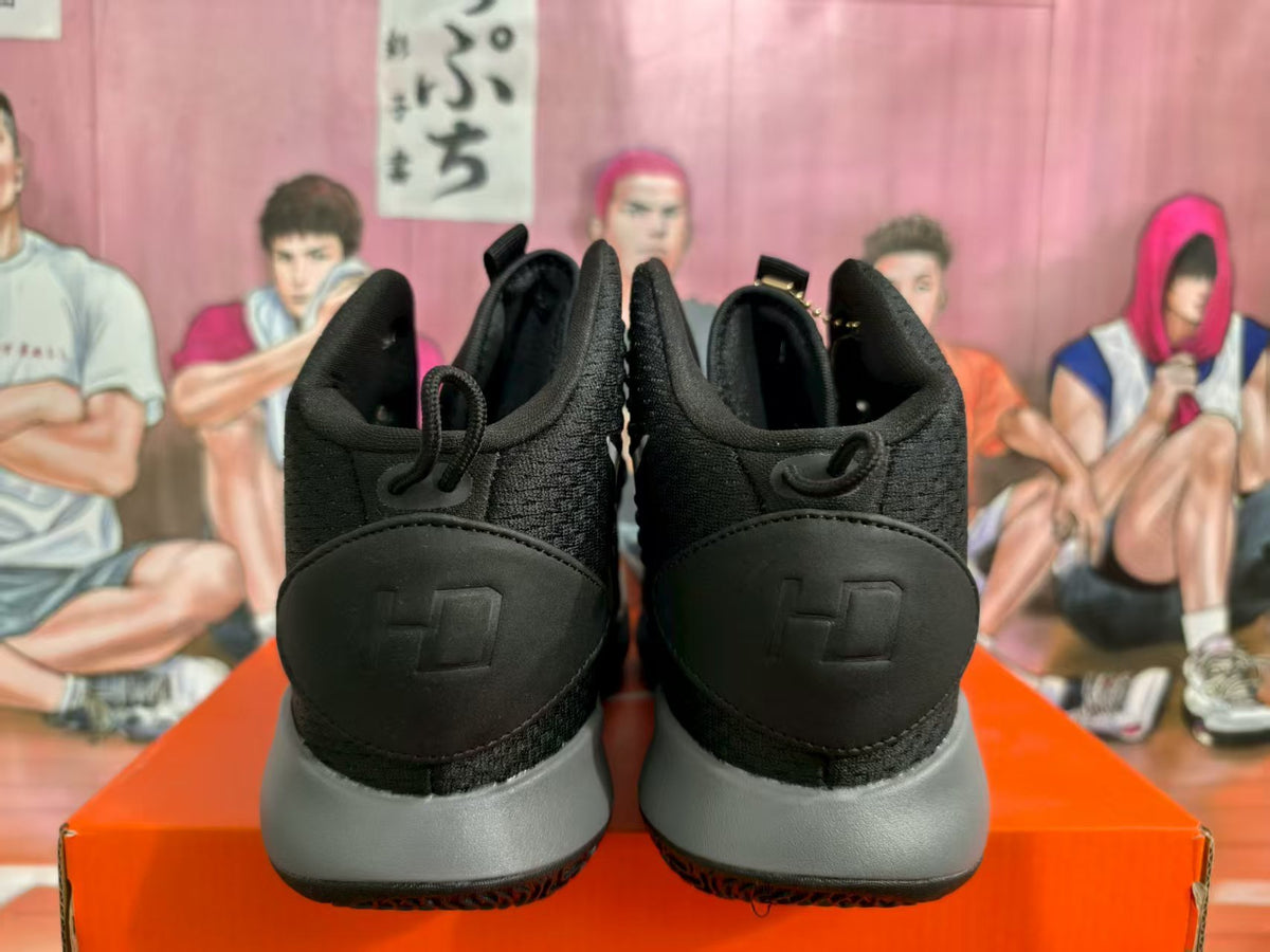 Rear view of black and grey Nike basketball sneakers showing padded collars, black heel panels and grey midsoles.