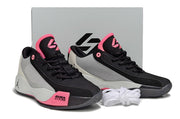 Black, pink and light gray Luka.77 sneaker pair displayed in front of a light-colored box.