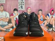 Front view showing the laces, tongues and textured outsoles of black Nike Hyperdunk shoes
