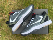 Angled side view of the shoes displayed on a shoebox