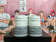 Rear view of the pair showing grey heel sections and the visible phrase “I CAN DO ALL THINGS.”