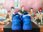 Rear view of the blue Nike Kobe sneakers with signature details on the heels.