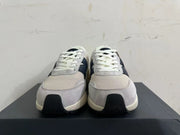Front view of New Balance U370 sneakers showing white laces, gray panels, and navy details.