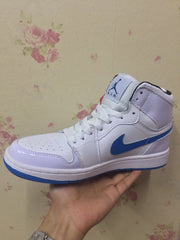 Side profile highlighting the high-top shape, blue Swoosh, and layered white panels.