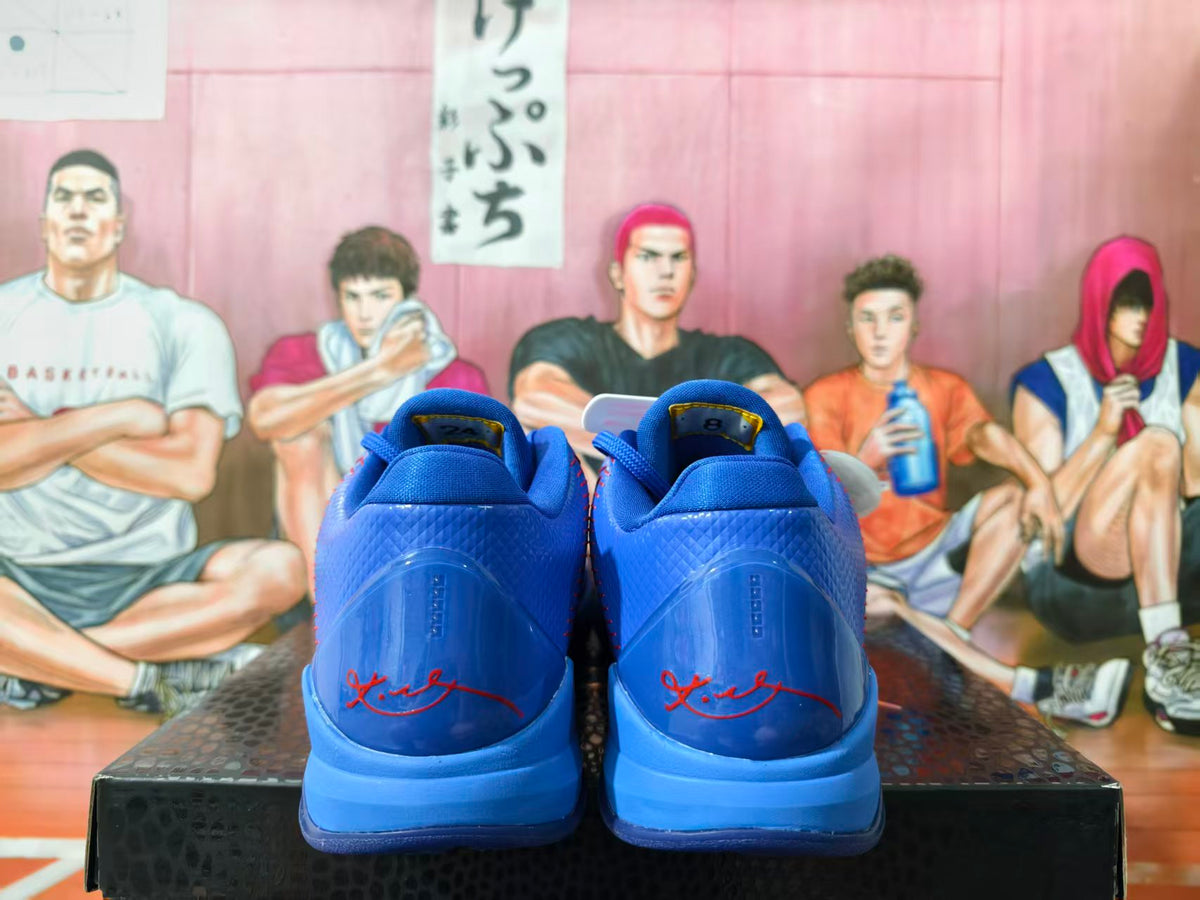 Rear view of blue Nike Kobe basketball shoes with red signature details.