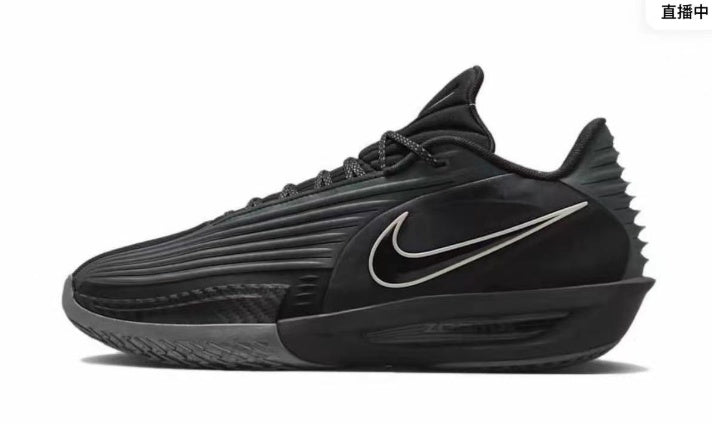 Side view of black Nike basketball sneakers with a contrasting Swoosh, layered upper, laces, and sculpted outsole.