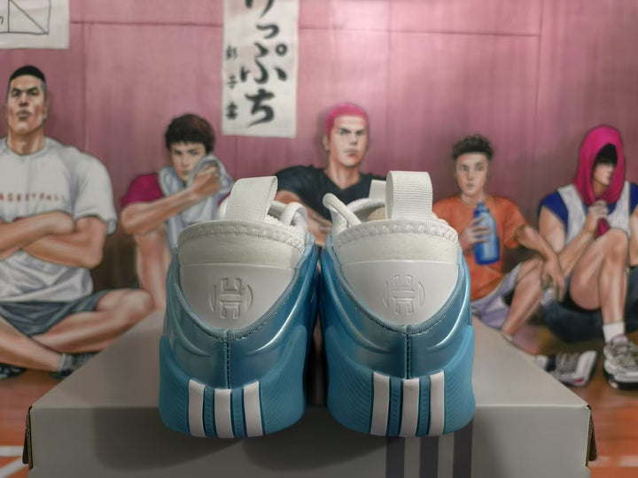 Rear view of blue and white sneakers showing the padded heels and heel pull tabs.