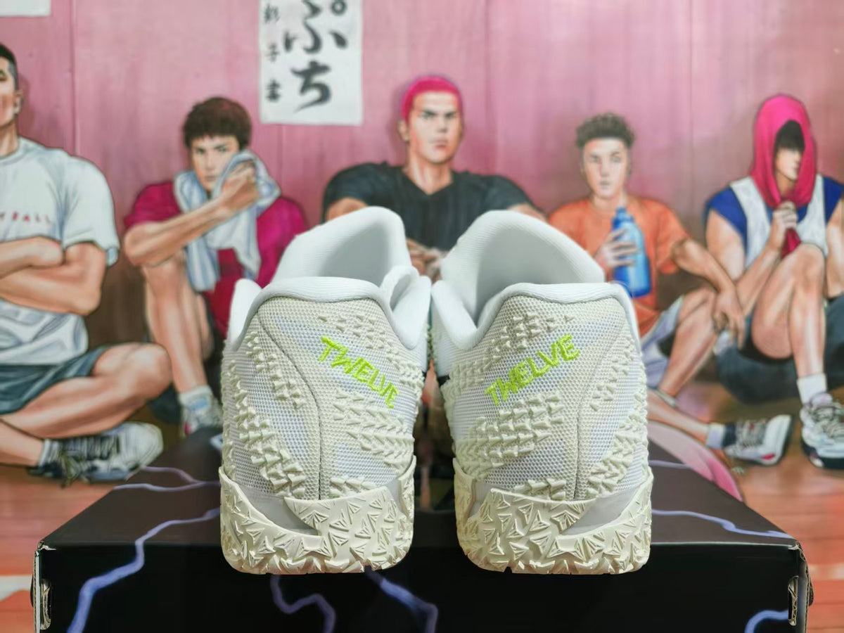 Rear view of white Nike shoes with lime-green heel lettering and a textured outsole.