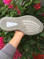 Close view of the translucent ribbed outsole and its visible boost-marked window.