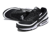 Pair of black and white Nike Air Max sneakers shown from above and at an angled side view.