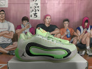 Side profile of a mint green and light gray Jordan sneaker showing the layered side detailing, heel logo, and visible cushioning design.