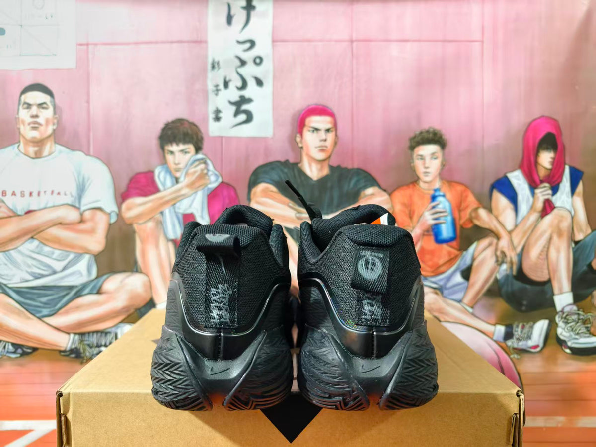 Rear view of black Nike basketball shoes showing heel details and textured outsoles