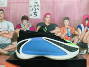 Side view showing a blue mesh-like panel, black upper, bright volt accents, and white overlays.
