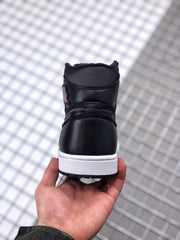 Rear view showing the black heel, padded collar, white midsole, and black outsole.