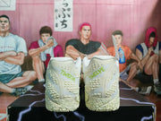 Rear view showing the textured heel panels and green printed heel lettering.