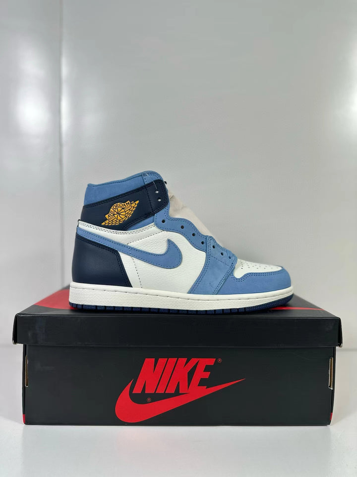 Side view of blue, white, and navy high-top Air Jordan 1 sneakers on a shoe box