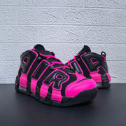 Front three-quarter view of the black and pink sneaker pair