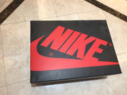 Detailed view of the grey Swoosh stitching and printed side text above the white midsole.