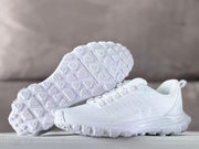 White Alo sneakers shown with one shoe displaying the lugged outsole.