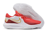 Red and white basketball shoe with gold-colored accents.