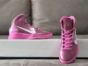 Front and side views of mauve and pink high-top basketball shoes.