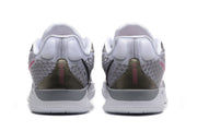 Rear view of the white and grey basketball shoes, showing pink heel detailing.