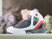 Outer side view highlighting the perforated collar panel, red heel accent, and dark gray midsole.