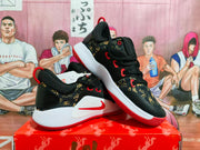 Angled view highlighting the gold patterned panels, red eyelet details, white midsole, and Nike Swoosh.