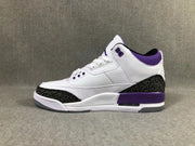 Side profile showing the white upper, dark elephant-pattern overlays, purple collar, and midsole accent.