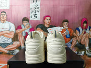 Rear view of white sneakers with heel pull tabs