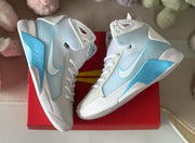 Top-down view of the Nike HD2008 kids sneakers displayed on a red box.
