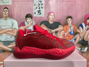 Side profile of a red sneaker showing its layered upper and sculpted midsole.