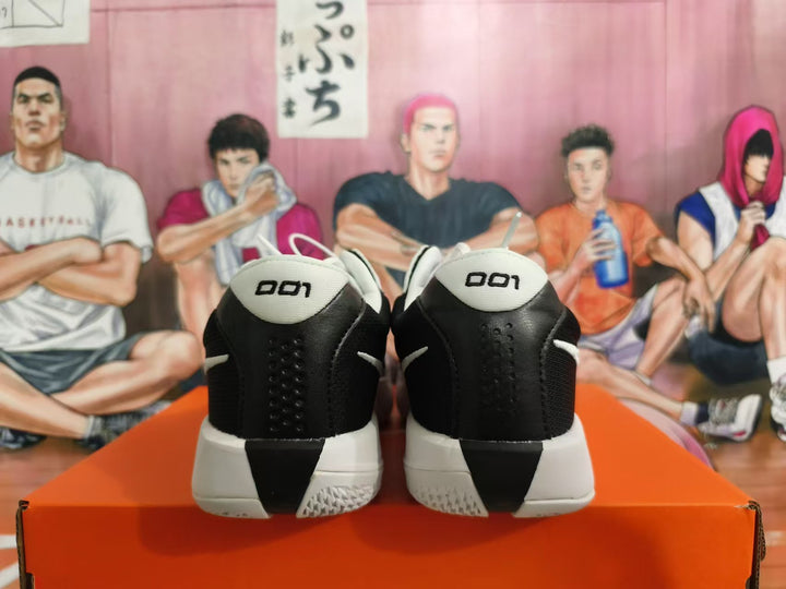 Rear view of white and black Nike basketball shoes showing the heel details.