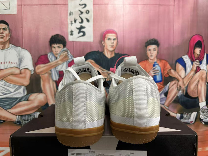 Rear view of white Converse Star Series sneakers with gum-colored outsoles