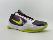Side profile showing the purple side panel, bright green Swoosh, and speckled midsole.