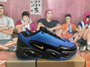Side view of blue and black Nike sneakers with yellow accent branding and textured blue panels.