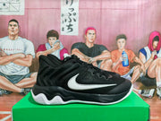 Side view of black Nike basketball shoes with a white Swoosh.