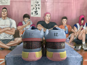 Rear view showing the padded blue collars, patterned heel panels, yellow midsole sections, and pink outsole details.