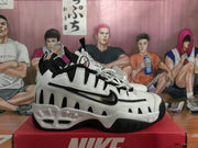 Side view showing the layered panels and Swoosh branding