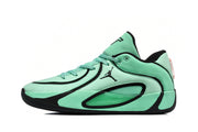 Side profile of a green and black Jordan sneaker showing the lace-up upper, Jumpman logo, padded collar, and translucent side panel.
