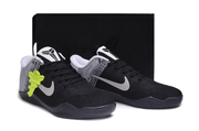 Pair of black and white basketball shoes displayed with a black box
